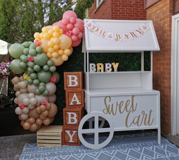 Dessert cart with 'Oh Baby' banner, 'Sweet Cart' decal, balloon garland, and 'BABY' blocks.