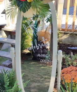 Custom welcome sign on a mirror with a decal printed on the surface.