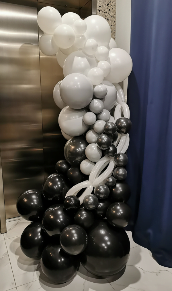 Black and silver balloon column.