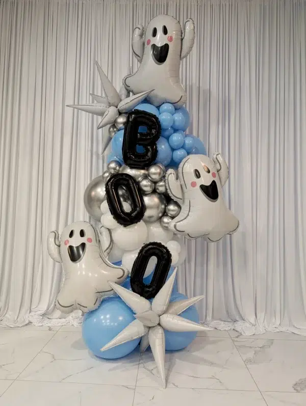 A festive balloon display featuring ghost balloons and the letters "Boo," in silver and blue, perfect for Halloween celebrations.