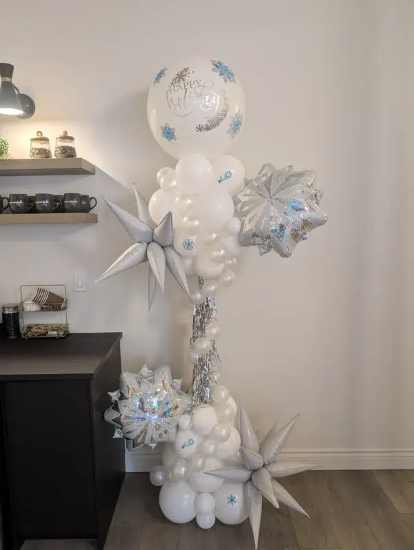 A festive balloon arrangement featuring a "Happy Holidays" balloon, silver stars, and white decorations, perfect for celebrations.