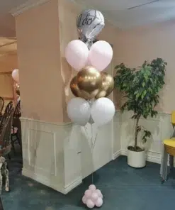 A latex balloon bouquet with nine balloons in black, white, and blue, topped by a checkered foil balloon