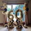 Custom balloon number stack with one large air-filled digit and a deluxe balloon base. Numbers and colours fully customizable.