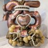 Tiramisu themed balloon number stack with mocha coloured foil balloon, dessert accents, cream and caramel balloon base, and personalized name decal. 🍰