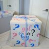Large white gender reveal box with pink and blue ribbon and “Girl or Boy?” text, designed to release helium balloon bouquet when opened. 💗💙