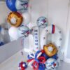 Baseball themed balloon number stack with red white and blue balloons, baseball accents, and custom name decal for a sports birthday celebration. ⚾