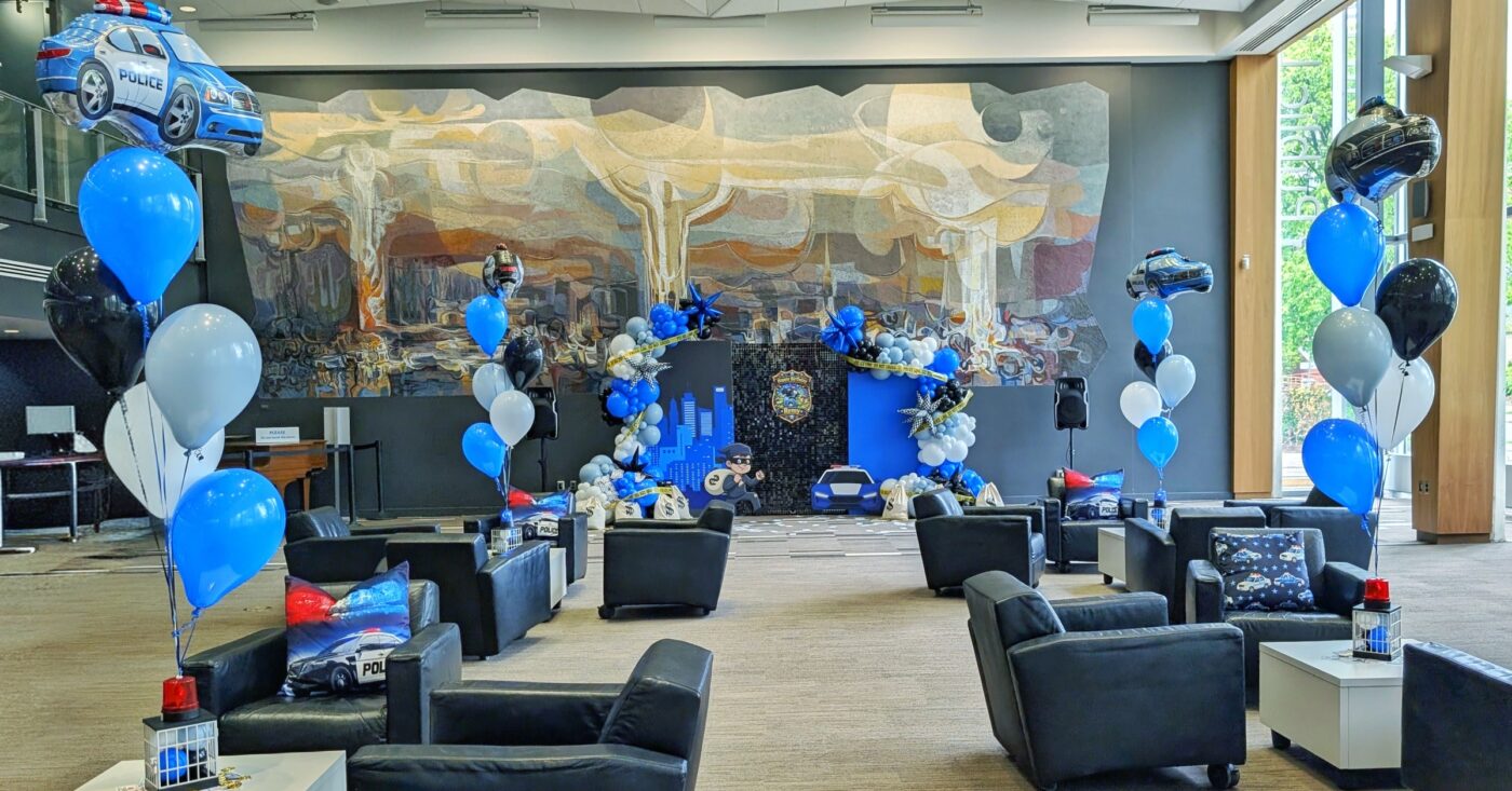 Cops and robbers birthday décor filling the Reading Lounge at Kitchener Public Library.
