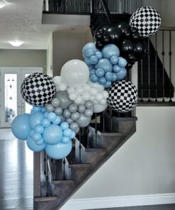 Black, blue, grey and white balloon garland with oversized black-and-white checkered balloon accents.