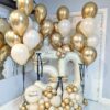 Golden anniversary balloon combo with personalized number stack and elegant gold and ivory helium balloon bouquets.