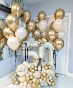 Golden anniversary balloon combo with personalized number stack and elegant gold and ivory helium balloon bouquets.