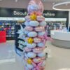 Latex-free rose gold and silver foil balloon column with metallic starbursts, gold stars and a branded topper.