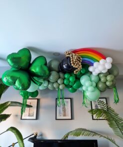Green St. Patrick’s Day balloon garland with shamrock, rainbow, pot of gold, white clouds and green fringe.