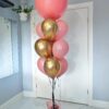Blush and reflective gold helium balloon bouquet featuring an oversized pink jumbo balloon.