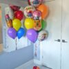 Colourful back-to-school helium bouquet with pencil foil, school balloons and bright latex balloons.
