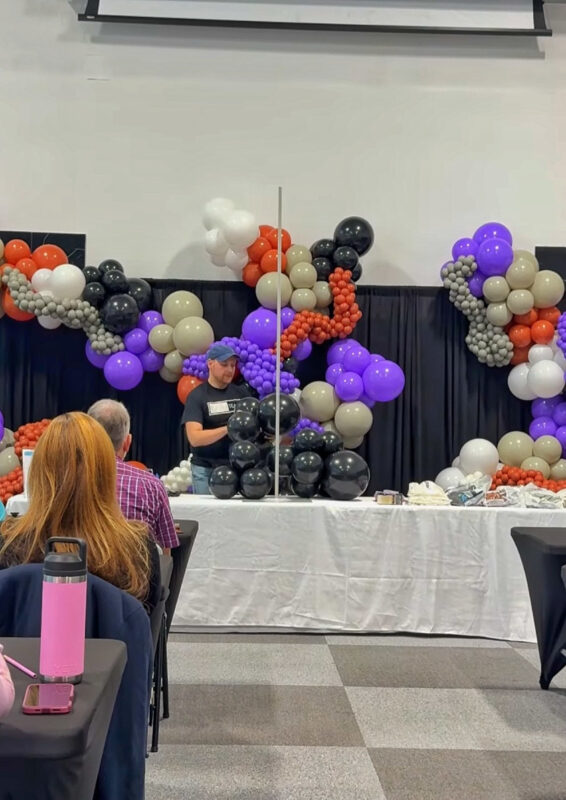 Students watching a freestanding balloon garland demonstration in Mississauga