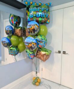 Minecraft birthday balloon bouquet with themed foil balloons and green and gold latex balloons.