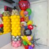 Two-piece back-to-school balloon bundle with a giant pencil column and personalized school-themed balloon display.