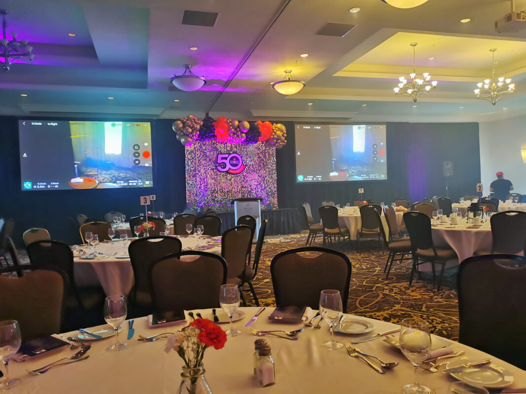 Delta Guelph ballroom set for Semex’s 50th anniversary with a decorated shimmer wall stage