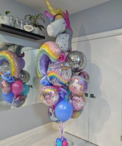 Large unicorn birthday balloon bouquet with rainbow, disco ball, themed foil, and colourful latex balloons.
